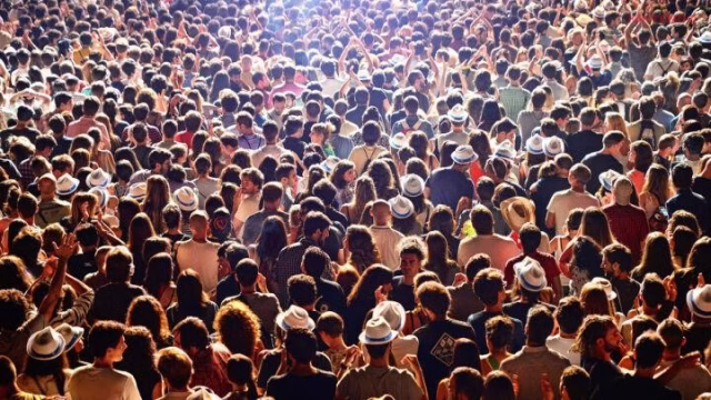 A high-density crowd at a public event demonstrating dangerous overcrowding conditions that can lead to crowd crush or stampede situations. (Image via Getty Images)