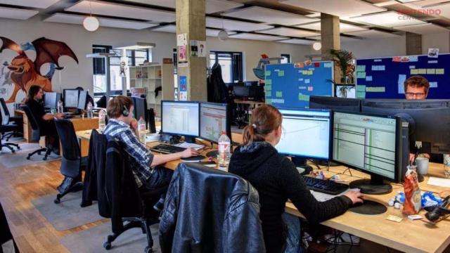 Game developers working inside a modern studio environment, highlighting the teams affected by layoffs in the gaming industry